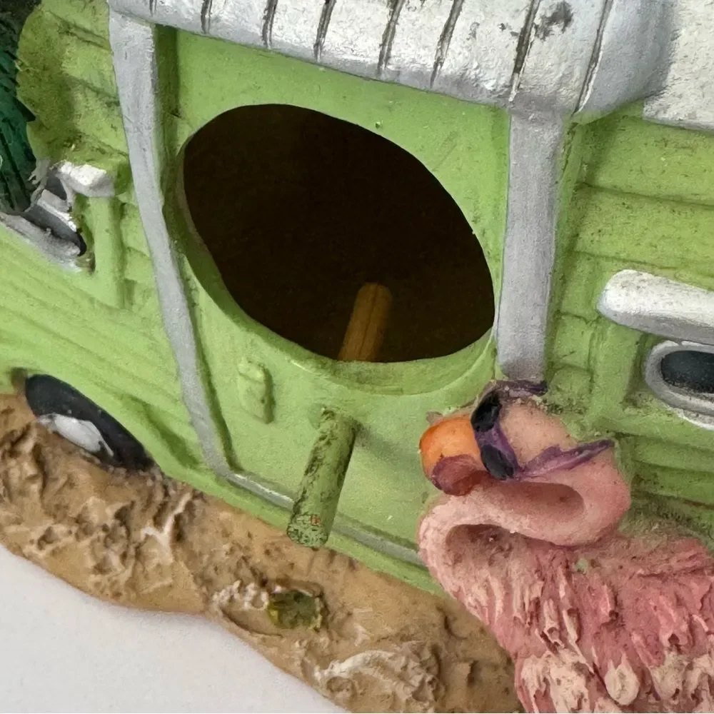 decorative resin RV camper birdhouse with a flamingo and a palm tree
